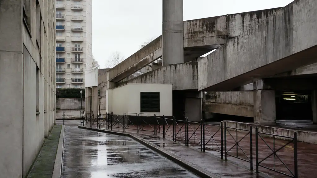 editorial analog photograph of a rain-soaked concrete city street with metal railings and a few muted colored details, cold desaturated atmosphere, no text, no logo